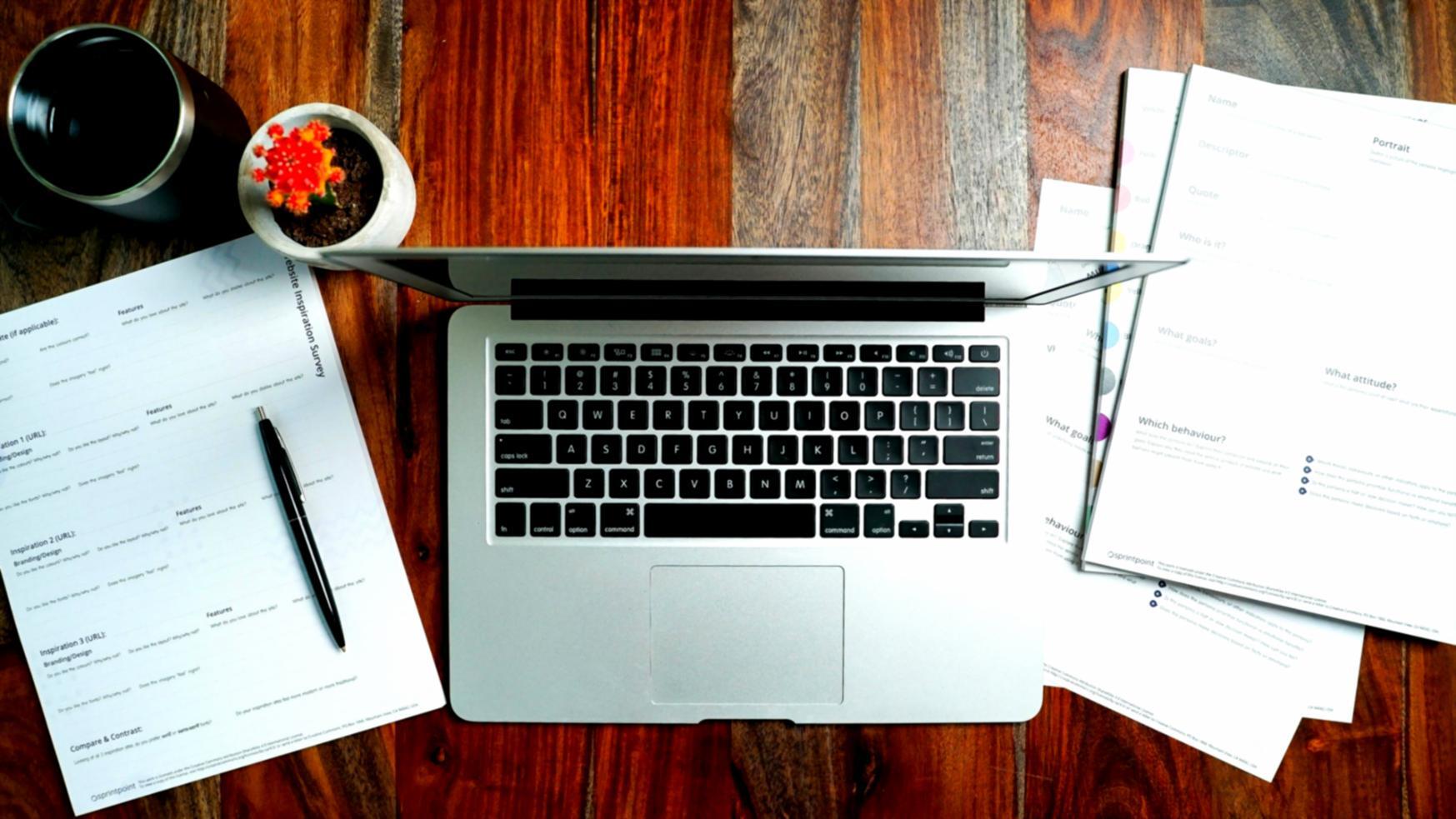 Financial data analysis workspace with charts and economic indicators